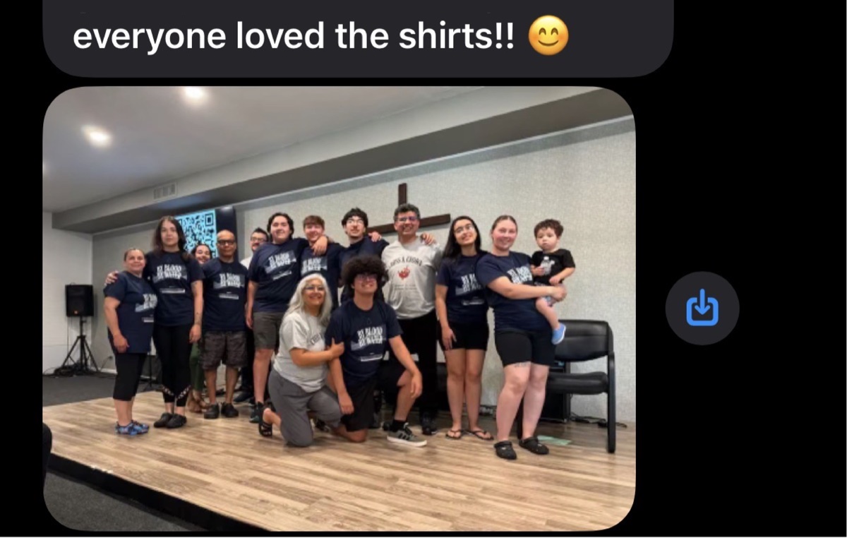 Customer text with a photo of a church group wearing their custom navy shirts: everyone loved the shirts!!